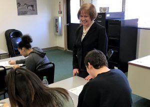 Mary Cahill talks to students in the classroom