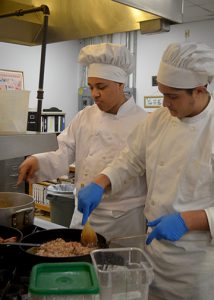 Students learning culinary skills