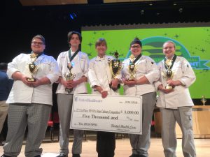 A group of culinary students are awarded a check