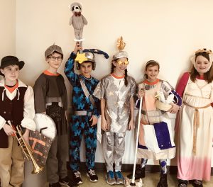 A group of five students wearing elaborate costumes