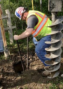 a student digs a hole