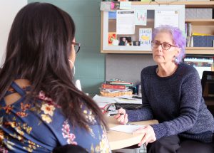 BOCES School Social Worker Diane Blinn speaks with a student.