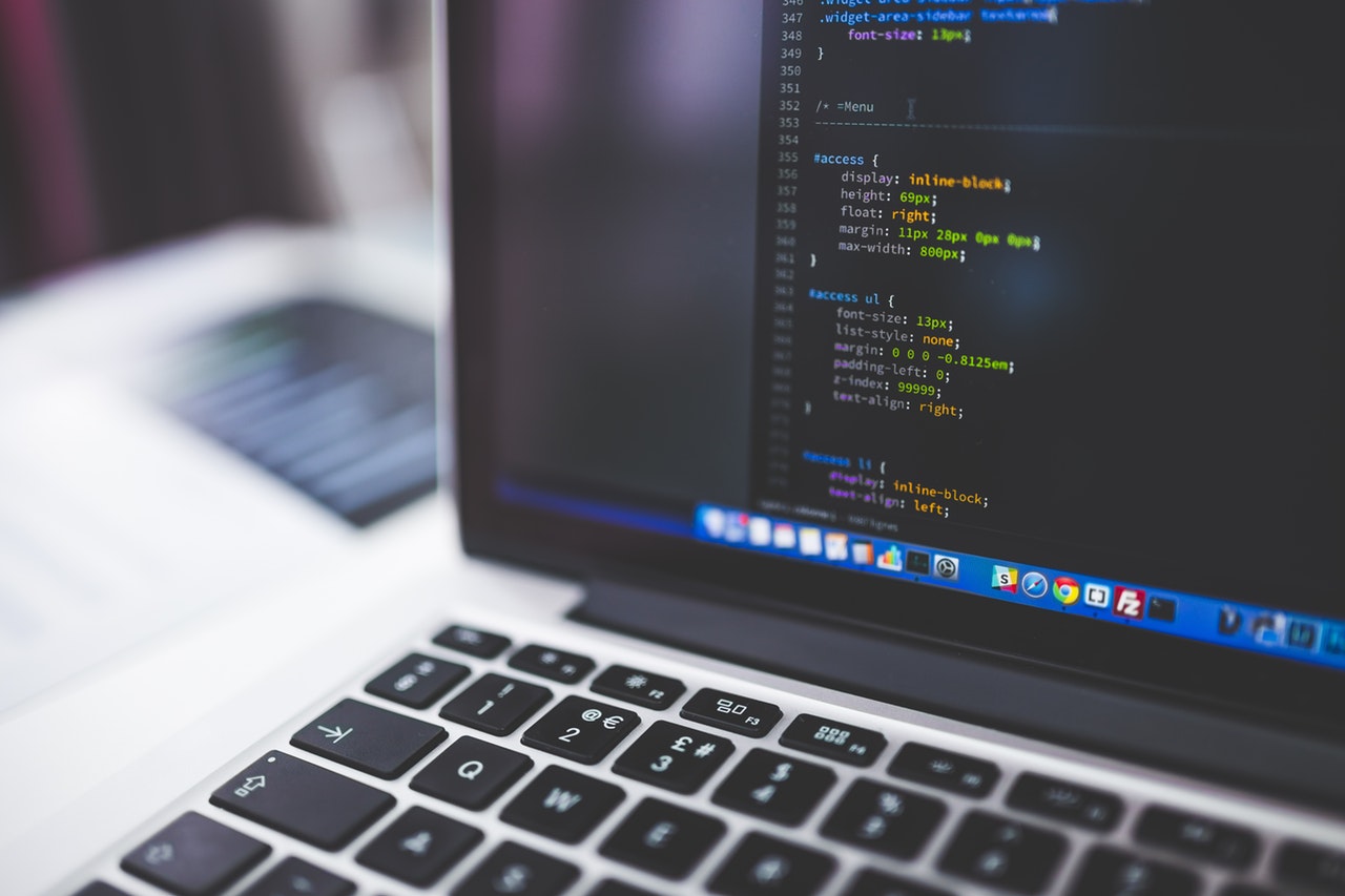 laptop with coding language on the screen