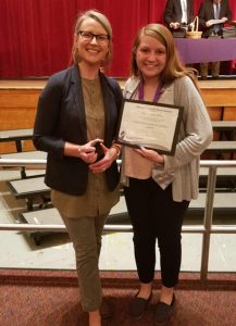 Instructor Erica Kane and recent New Visions graduate Allison Norris smile for the camera.