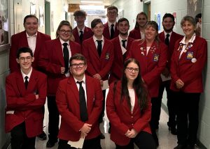 New SkillsUSA officers from the Capital Region BOCES Career and Technical School pose as a group wearing red blazers and black pants.