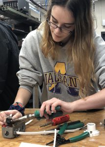Adriana Holden works with tools in a Capital Region BOCES heating, ventilation, air conditioning and refrigeration classroom.