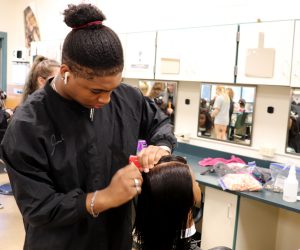 Josiah Courtwright of Niskayuna works on a mannequin head in a Capital Region BOCES cosmetology classroom.