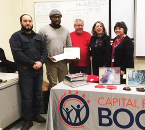 Welding student Kingsley Okechukwu Ubaka receives the Evan M. Schwarz Helping Hand Memorial Scholarship