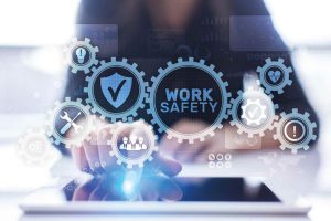 Student points to illuminated sign that reads 'Work Safety'