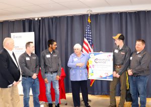 Group of five capital region BOCES employees and students accepting an award