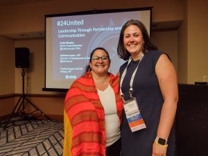 District Superintendent Anita Murphy smiling, standing with Director of Engagement and Development Services, Adrienne Leon