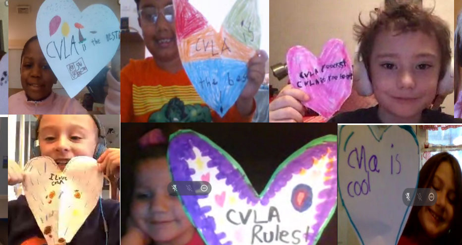 A photo montage of various young children, all looking at their web camera. Many are smiling and holding up paper hearts with colorful designs and words such as "I Love CVLA" and "CVLA Rocks"