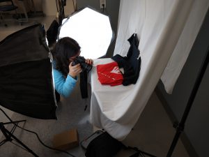 Emily Burdikoff takes photo of red t-shirt