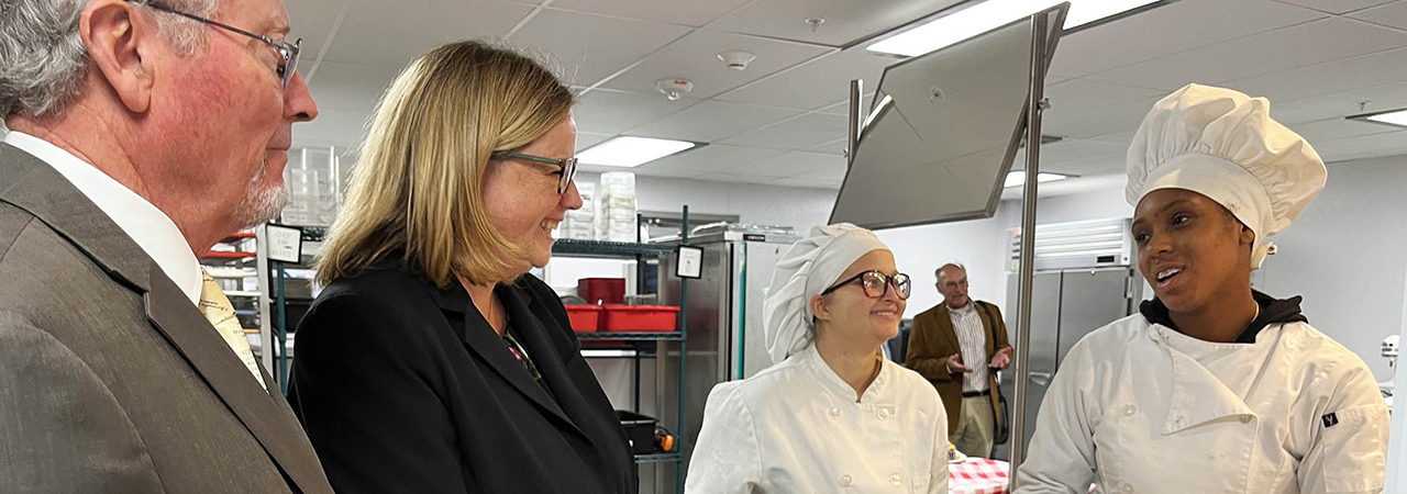 Richard Ball, USDA Under Secretary, and Jenny Lester Moffitt, USDA, speak with Reagan La Fountain and Navarah Davis of the Mohonasen Culinary program.