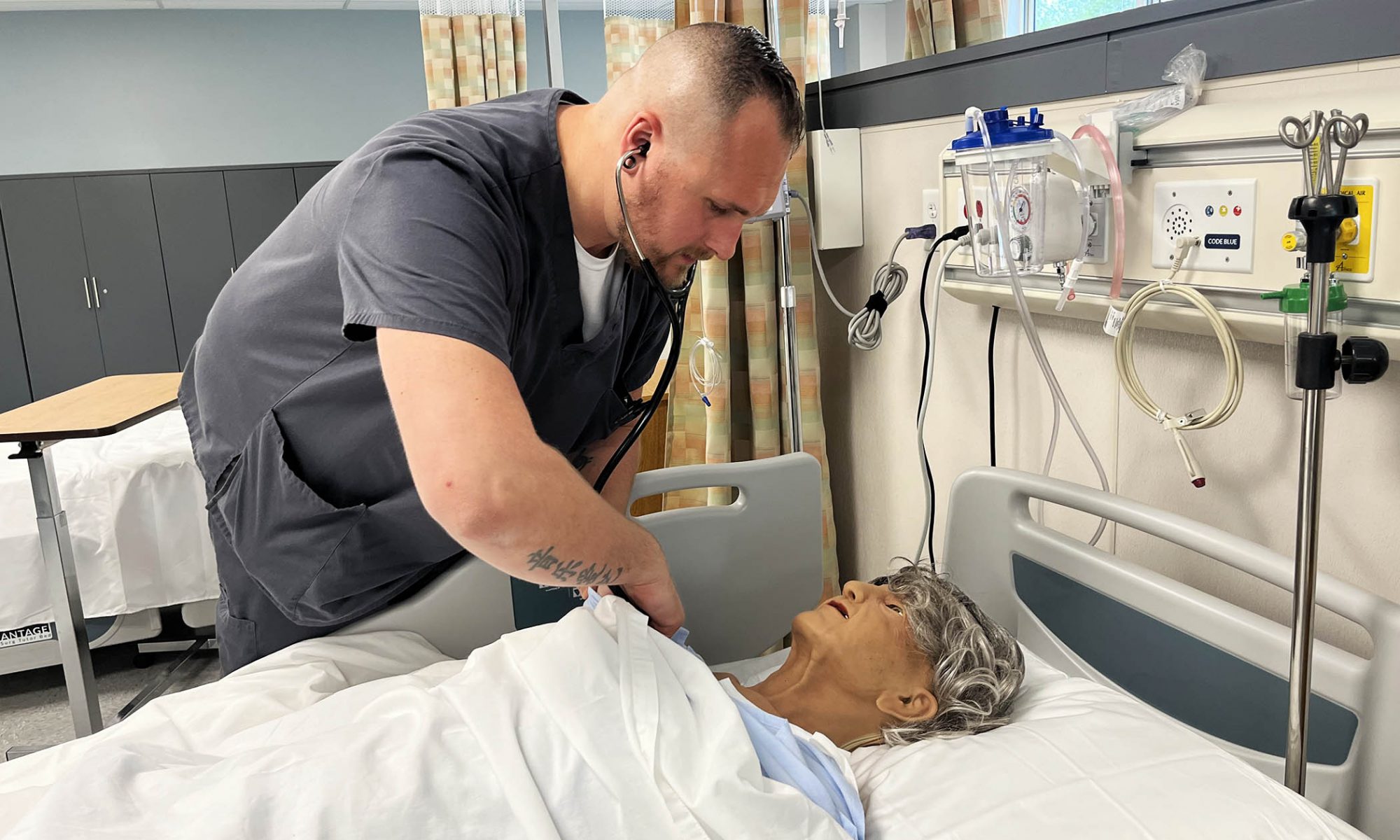 Dante Pierotti tends to a "dummy" patient at Capital Region BOCES' Career & Tech school.