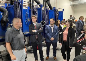 CTE Albany Principal Jeff Palmer leads a tour group through the campus