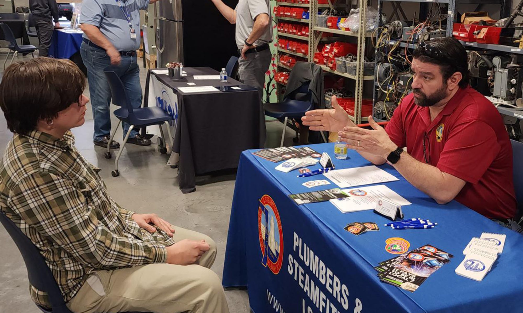 A student listens to a representative during a BOCES Career Day.