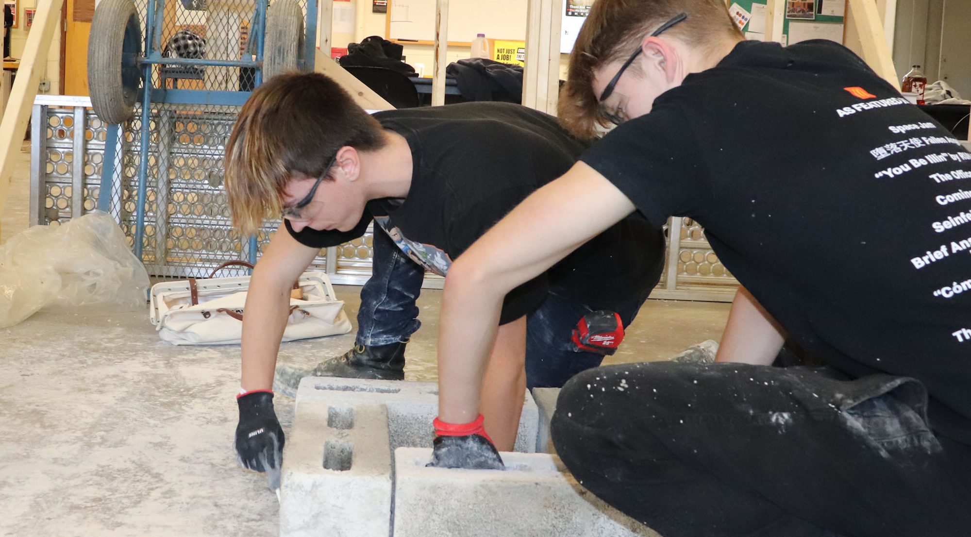 two masonry students working