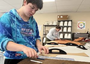 Measure twice, cut once. That's what Career and Technical Education Global Fashion Studies seniors Sophia Berlin is prepared to do as she applies a ruler to the task.