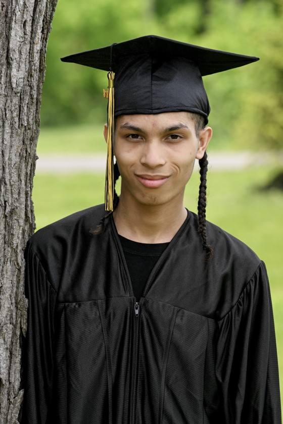 student near a tree