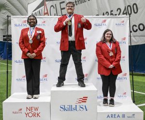 Students pose on the podium