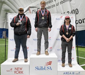 Students pose on the podium