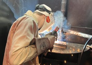 A student welds