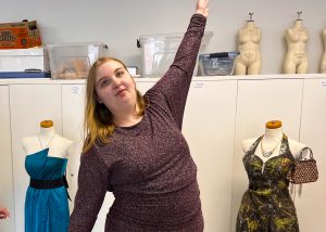 A student poses in a dress