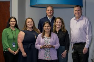 Jennifer Bloomingdale receives March 2025 improvement commitment award from Lauren Gemmill, Melissa Boucher, Dave Versocki, Elizabeth Wood and Mike Sylofski