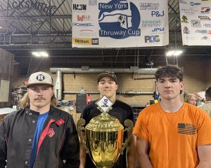 Students pose around the trophy