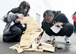 Students sift through the rubble