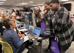 Adult nursing students talk to recruiters