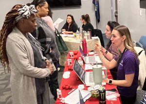 Recruiter and student talk at a table