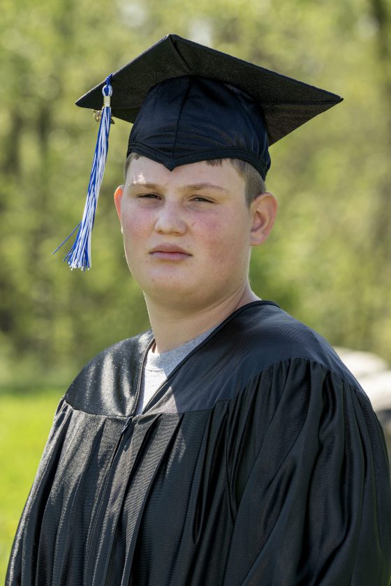 A photo of Maywood Academy graduate Eric Lounsbury in his cap and gown.