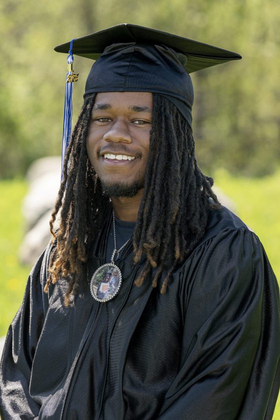 A photo of Maywood Academy graduate Daireem Tibbs in his cap and gown.