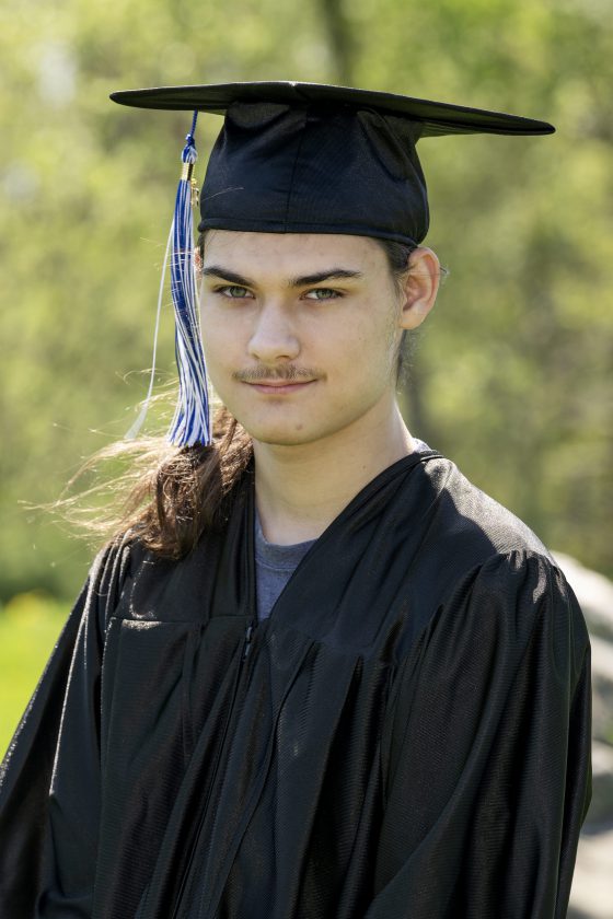 A photo of Maywood Academy graduate Nickolas Eilts in his cap and gown.