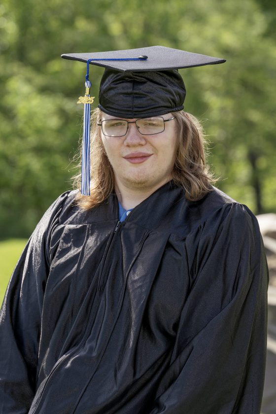 A photo of Maywood Academy graduate Mathew Stocks in his cap and gown.