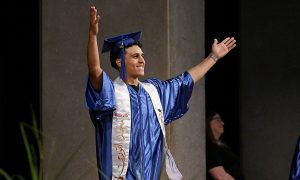Student celebrates on stage