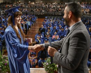 Student shakes hands