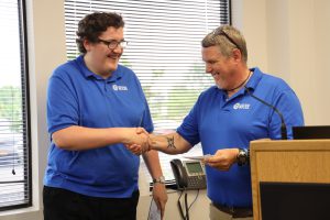 SELFI Program graduate shakes hands with SELFI Program teacher. 
