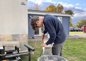 student working on tiny home