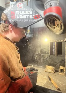 A student welds
