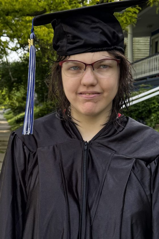 A photo of Maywood Academy graduate Gloria VanBuren in her cap and gown.