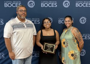 Nadia poses with her family