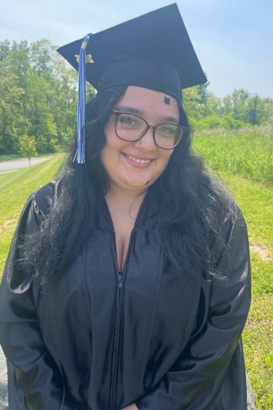 A photo of Maywood Academy graduate Sierrah Rivera in her cap and gown.