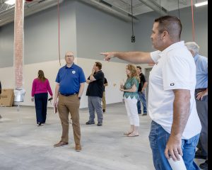 Jeff pointing to dignitaries while speaking