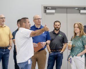 Jeff Palmer points as he talks to guests