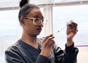 Student prepares a syringe 