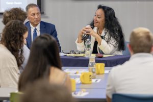 New York Sate Education Commissioner Betty Rosa speaks to a room full students alongside Jay Worona, New York State School Boards A Deputy Executive Director and General Counsel.
