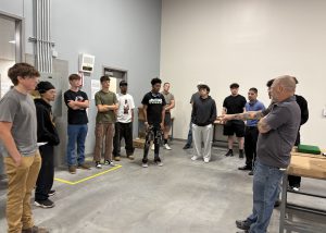 Plumbing teacher and student in the shop